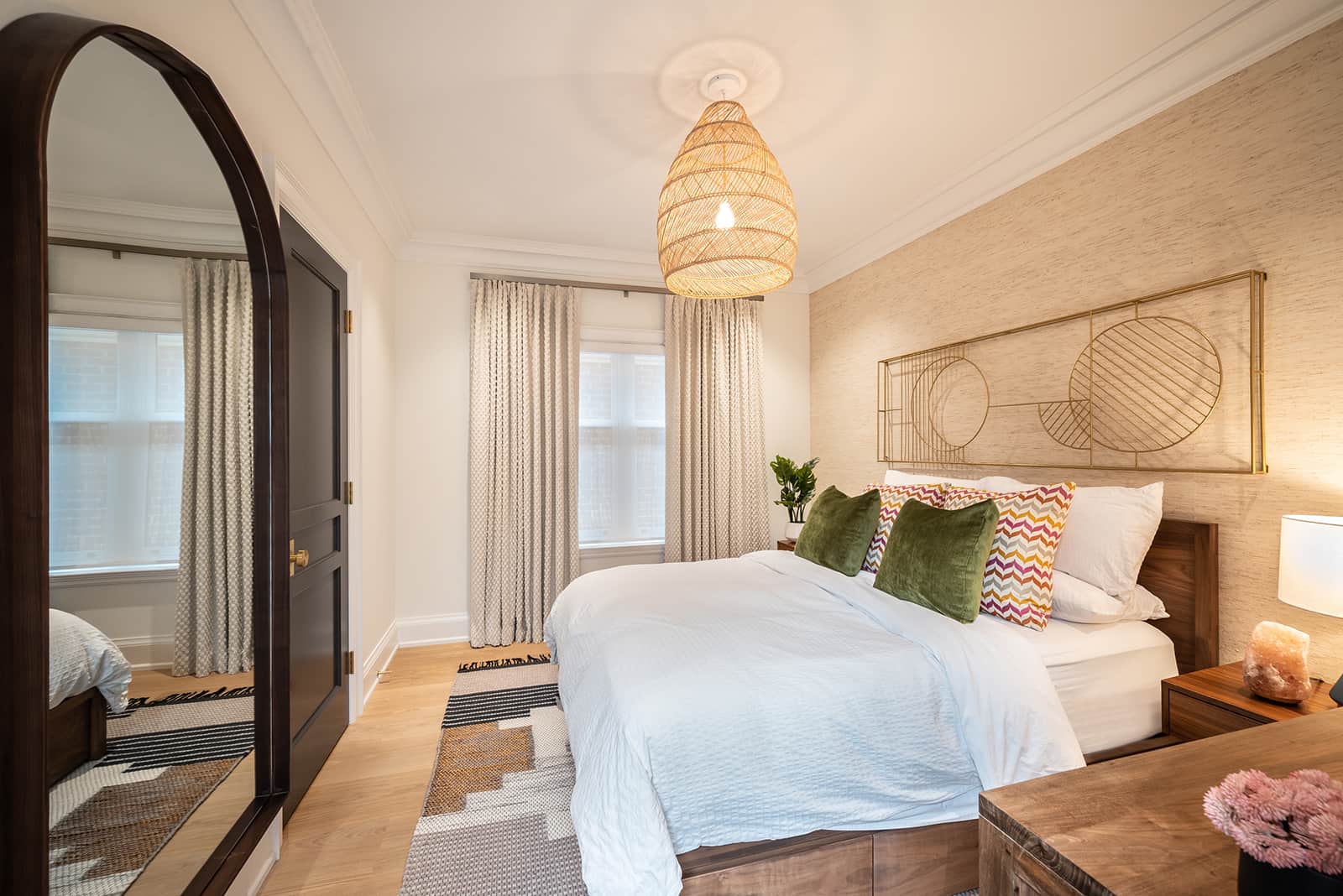 bedroom with large mirror and warm lighting