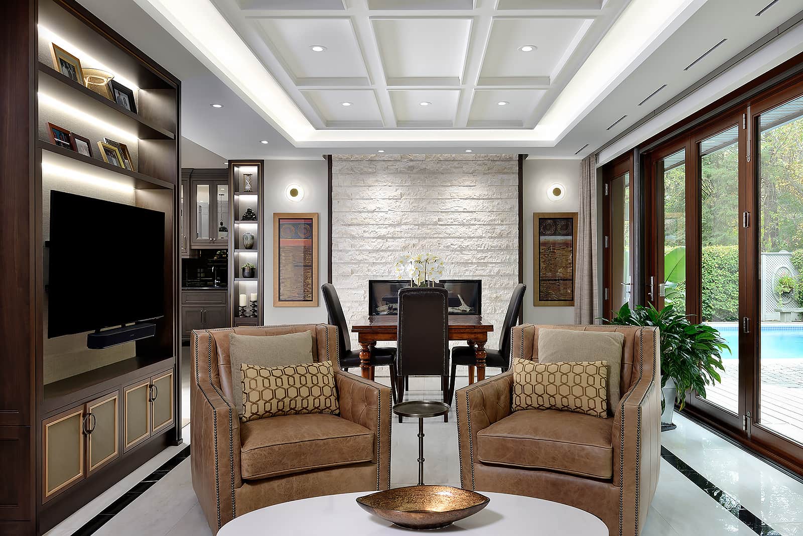 living room with two brown leather chairs